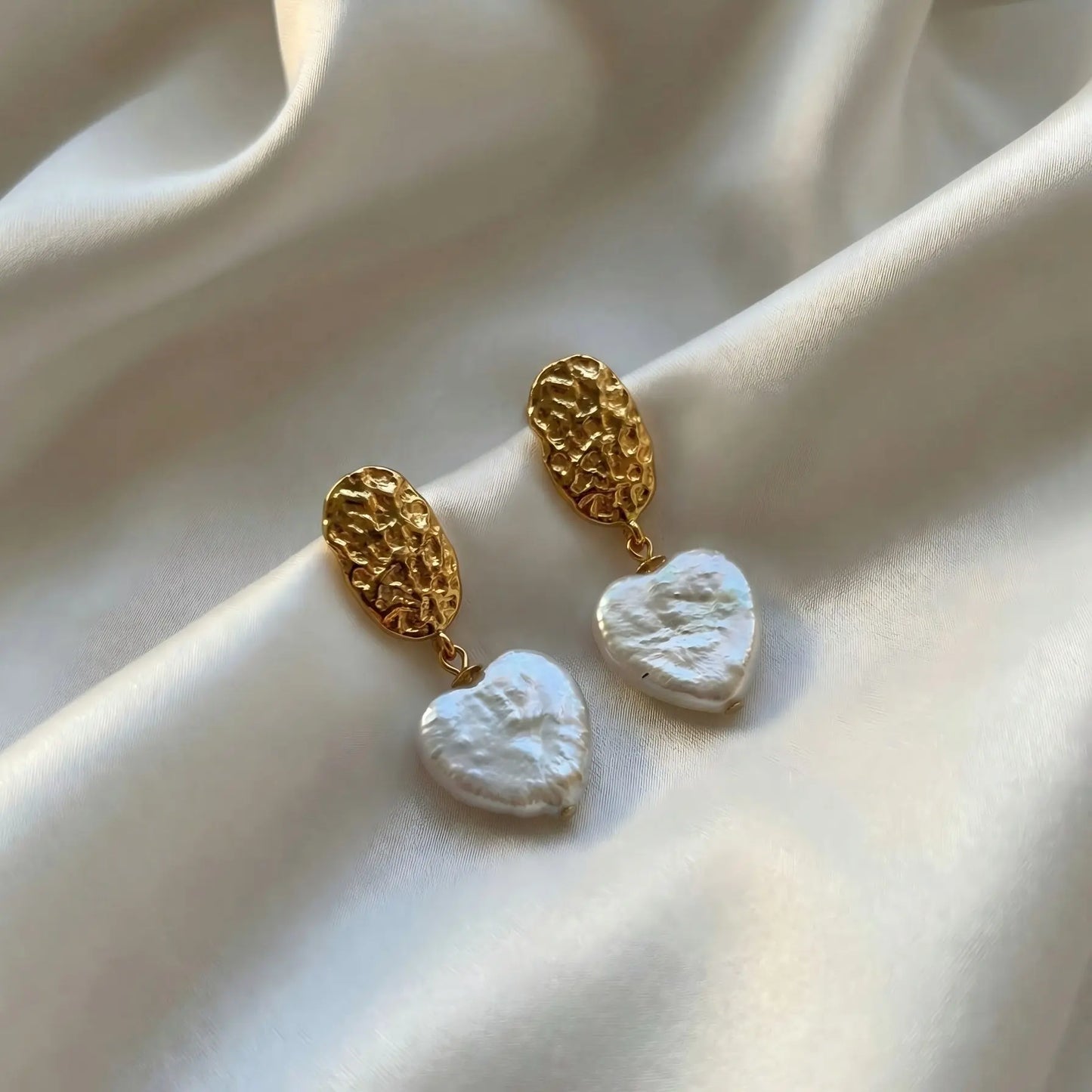 A romantic token from the sea, bathed in golden light.