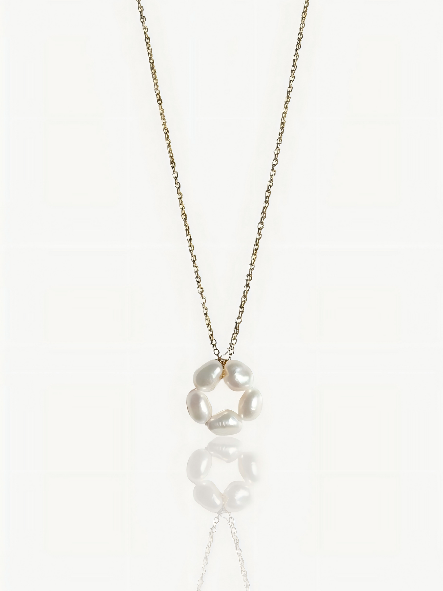 Close-up product shot of Pearltide’s minimalist petal baroque pearl pendant necklace, showcasing a high-luster sculptural pearl on a dainty 14K gold-filled chain against a clean white background. Elegant wedding and everyday statement jewelry.