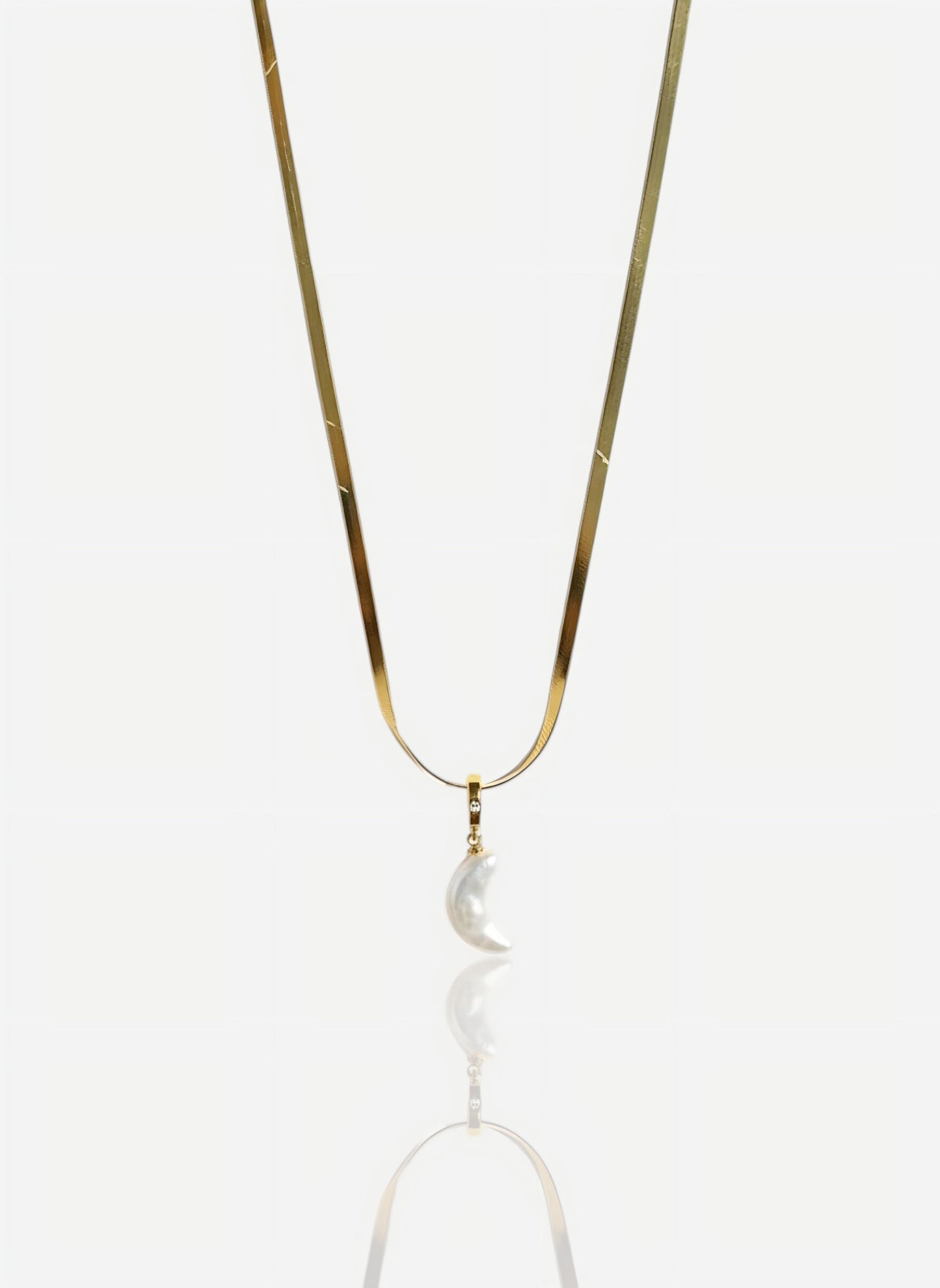 The pendant is on a wide, flat snake chain in heavy 18k gold vermeil over sterling silver, shot against a seamless white background.