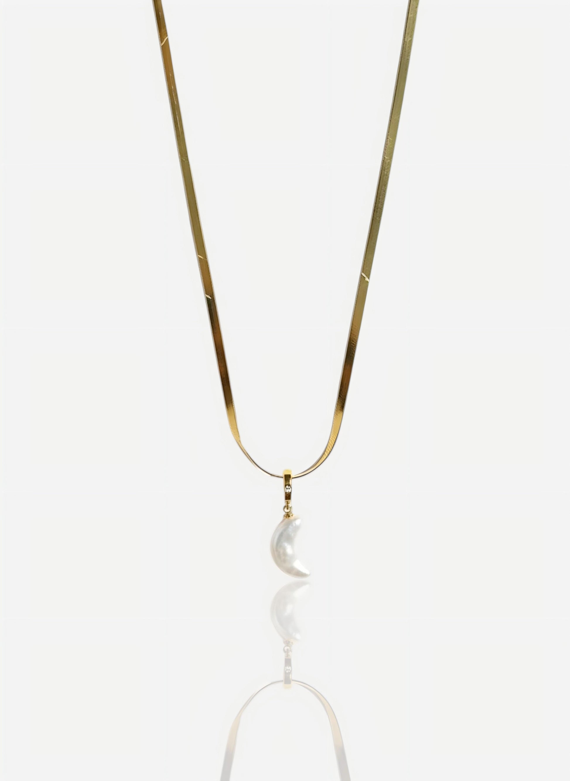 The pendant is on a wide, flat snake chain in heavy 18k gold vermeil over sterling silver, shot against a seamless white background.