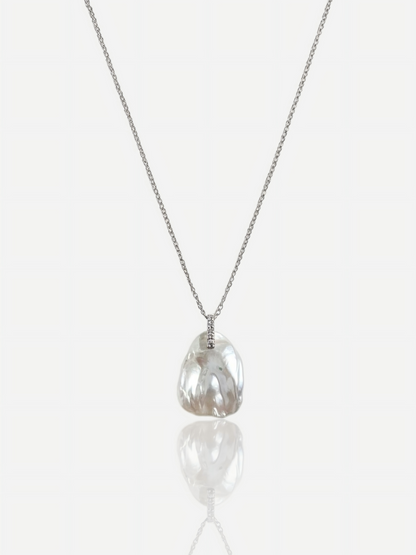 High-luster petal baroque pearl pendant necklace with diamond-accented bail on S925 sterling silver chain, elegant minimalist wedding jewelry for modern brides.