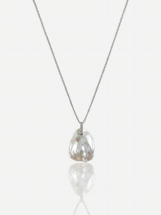 High-luster petal baroque pearl pendant necklace with diamond-accented bail on S925 sterling silver chain, elegant minimalist wedding jewelry for modern brides.