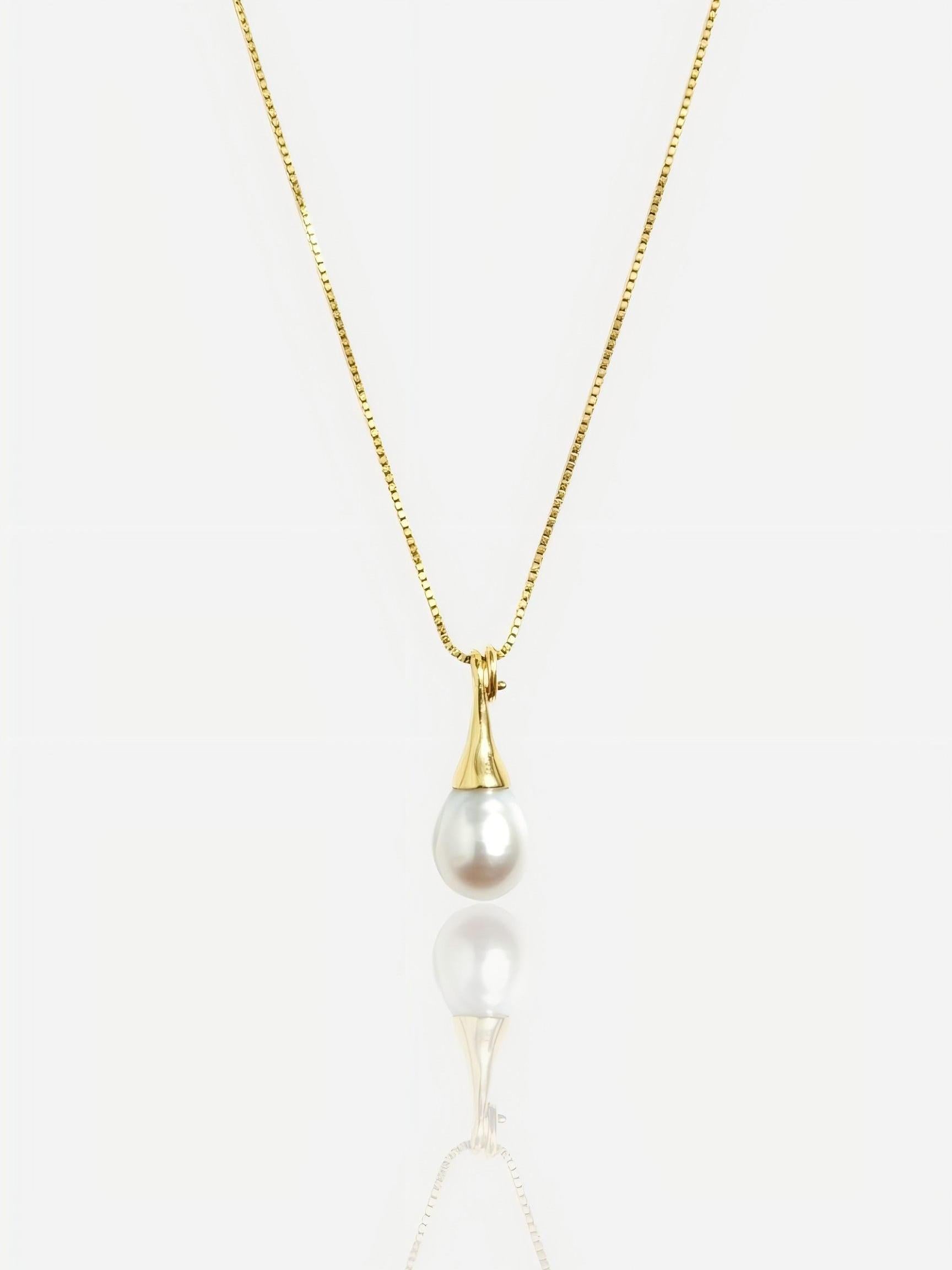 Close-up of Pearltide sleek teardrop pearl pendant with a modern tapered gold bail on a 14K gold-filled box chain, high-luster minimalist bridal jewelry.