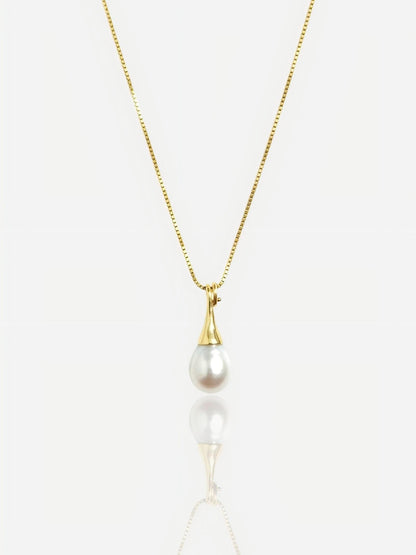 Close-up of Pearltide sleek teardrop pearl pendant with a modern tapered gold bail on a 14K gold-filled box chain, high-luster minimalist bridal jewelry.