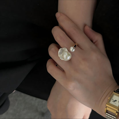 Close up of iridescent baroque pearl texture on a gold vermeil band.