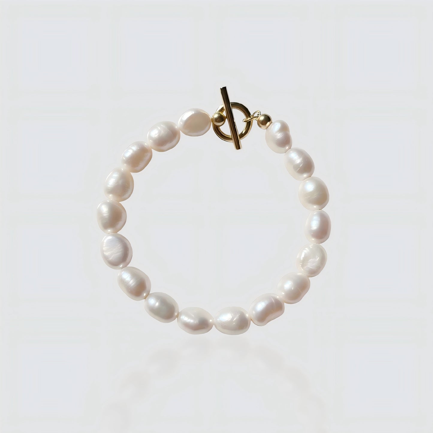 A clear view of our high-quality freshwater pearls and the durable gold T-bar clasp.
