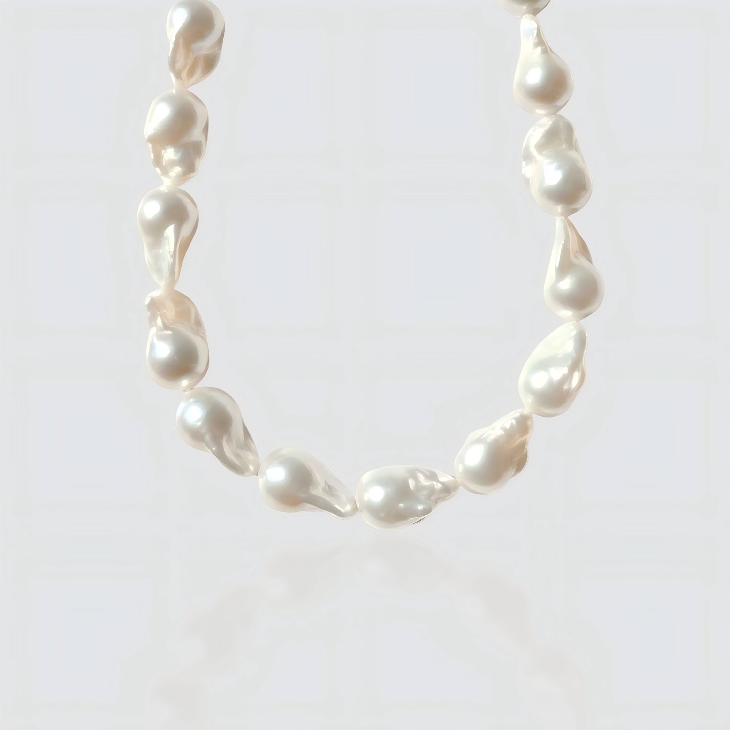 A clear view of the unique, organic shapes of each large baroque pearl. No two strands are exactly alike.