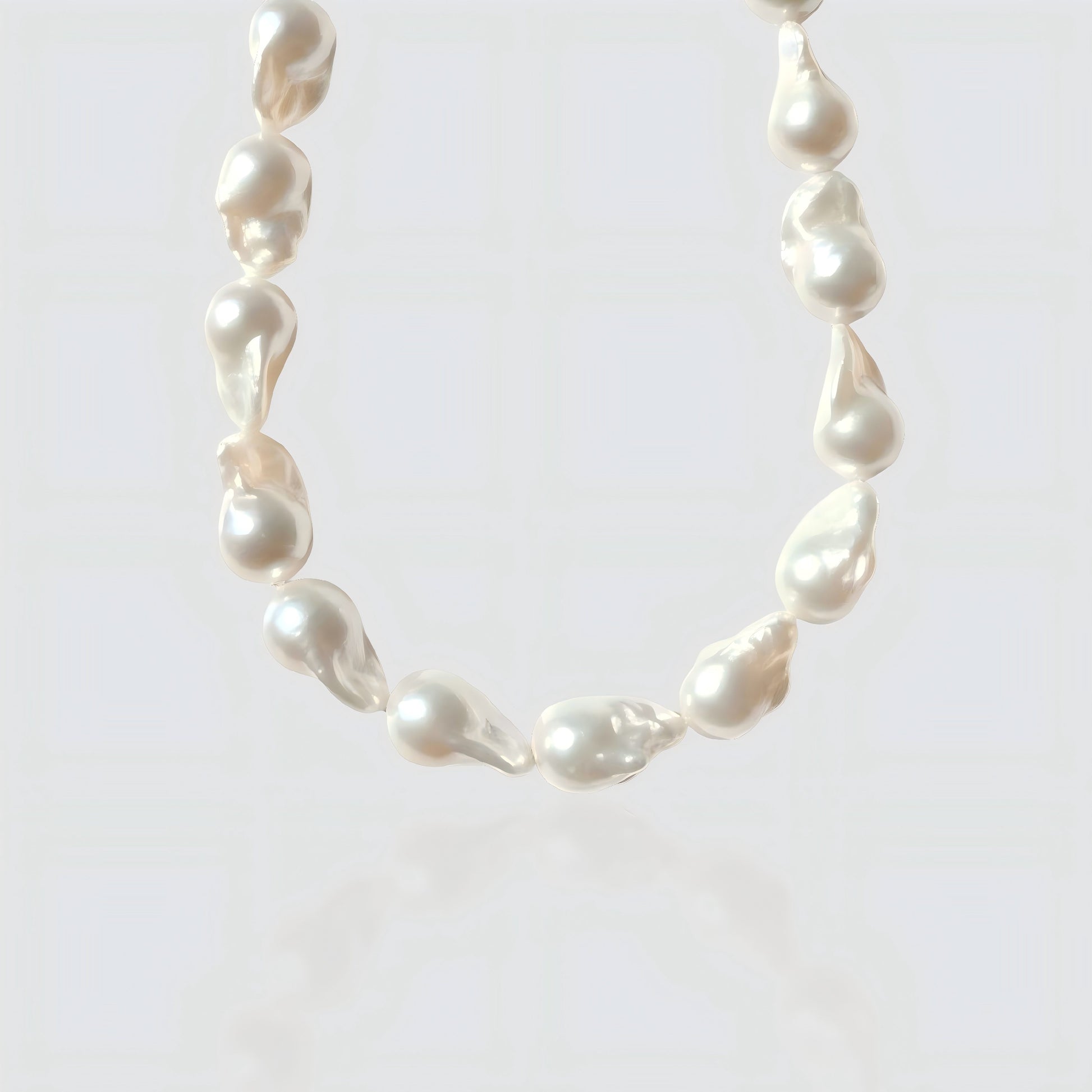 A clear view of the unique, organic shapes of each large baroque pearl. No two strands are exactly alike.