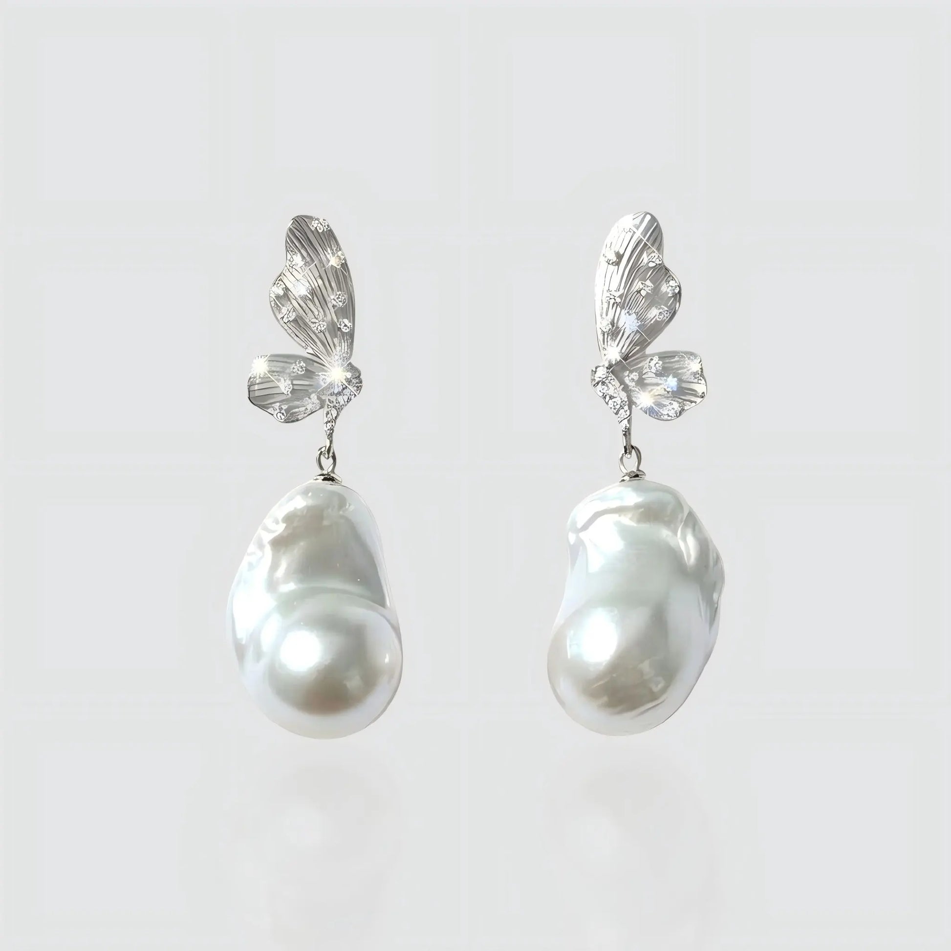 The Moonlit Monarch: Silver Butterfly Earrings with Large Baroque Pearls