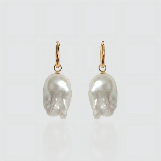 Pearltide The Aurora Drop earrings featuring genuine natural baroque pearls set in polished 18K gold plated metal, flat lay view.