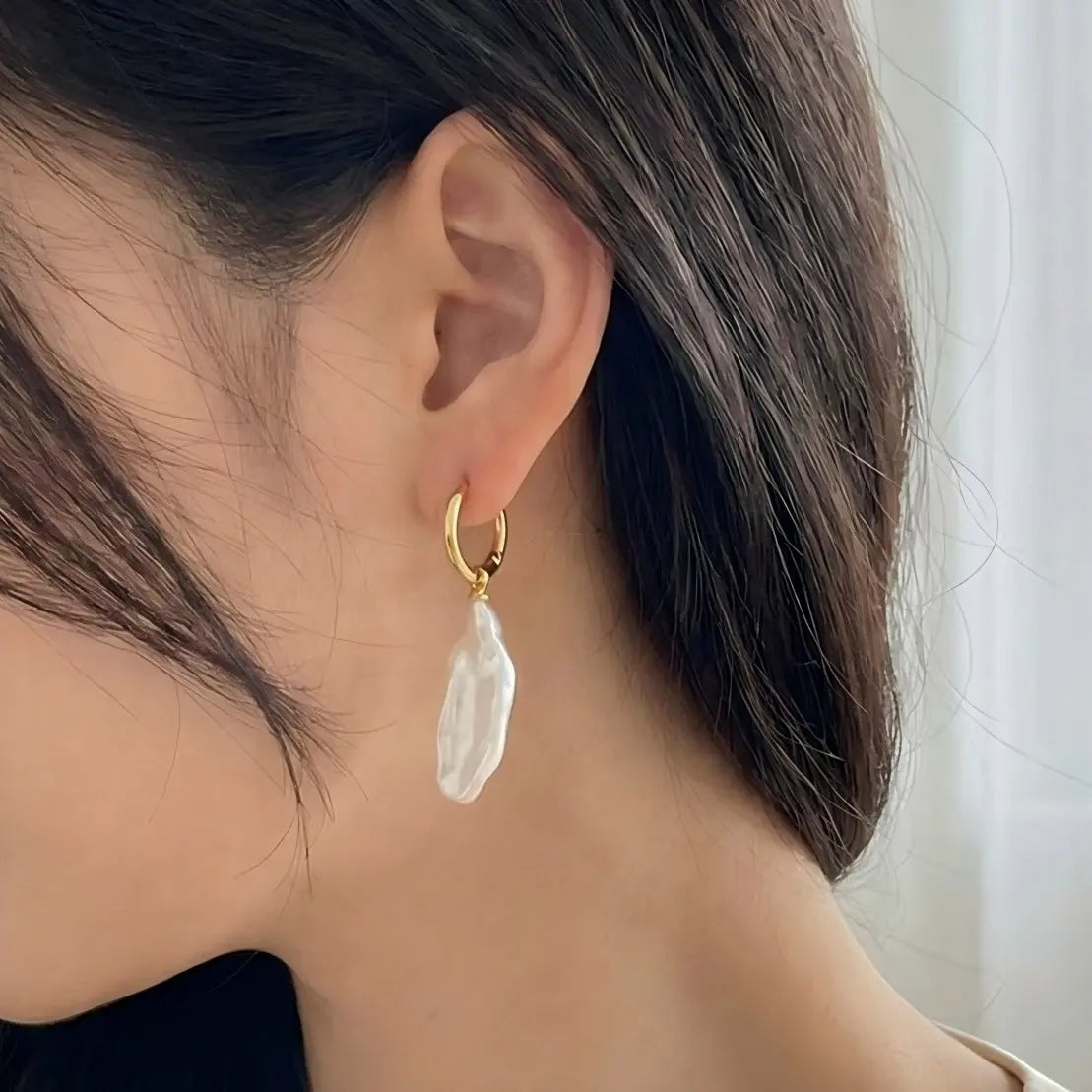 Effortless Style: Raw Stick Pearl Earrings on Model