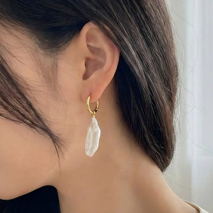 Effortless Style: Raw Stick Pearl Earrings on Model